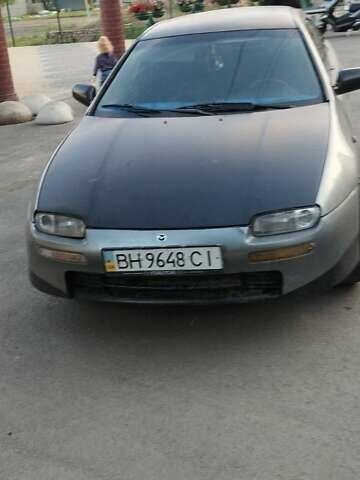 Сірий Мазда 323, об'ємом двигуна 1.5 л та пробігом 100 тис. км за 1800 $, фото 1 на Automoto.ua