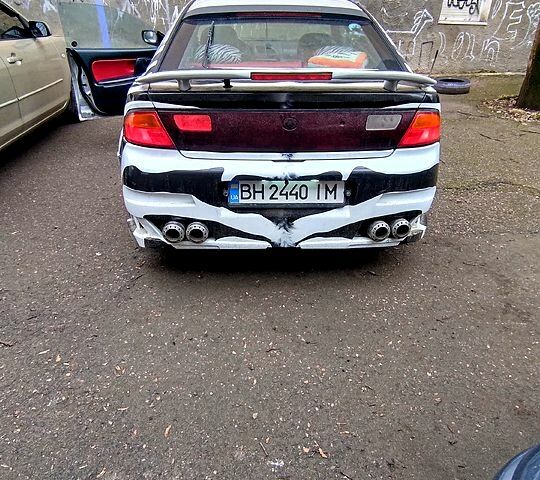 Серый Мазда 323, объемом двигателя 1.5 л и пробегом 307 тыс. км за 2000 $, фото 1 на Automoto.ua