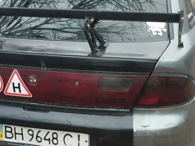 Сірий Мазда 323, об'ємом двигуна 0 л та пробігом 400 тис. км за 1200 $, фото 1 на Automoto.ua