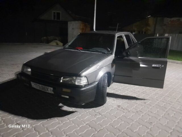 Сірий Мазда 323, об'ємом двигуна 0 л та пробігом 200 тис. км за 710 $, фото 1 на Automoto.ua