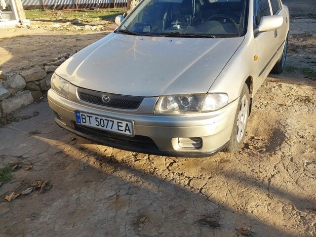 Сірий Мазда 323, об'ємом двигуна 1.5 л та пробігом 400 тис. км за 2383 $, фото 1 на Automoto.ua