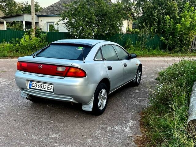 Серый Мазда 323, объемом двигателя 1.5 л и пробегом 250 тыс. км за 1800 $, фото 1 на Automoto.ua