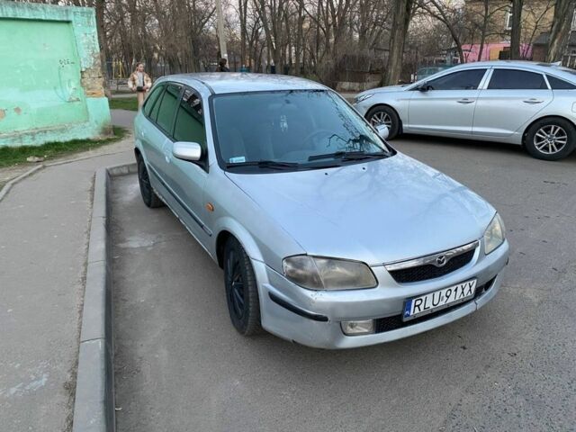Серый Мазда 323, объемом двигателя 2 л и пробегом 304 тыс. км за 1999 $, фото 1 на Automoto.ua
