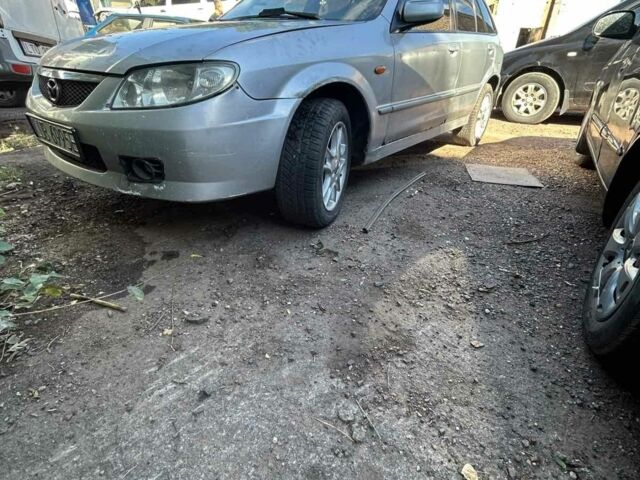 Серый Мазда 323, объемом двигателя 2 л и пробегом 290 тыс. км за 401 $, фото 1 на Automoto.ua