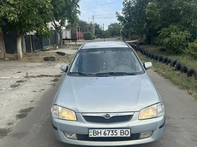 Сірий Мазда 323, об'ємом двигуна 1.5 л та пробігом 330 тис. км за 2004 $, фото 1 на Automoto.ua