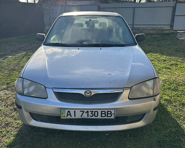 Серый Мазда 323, объемом двигателя 1.5 л и пробегом 230 тыс. км за 2400 $, фото 1 на Automoto.ua