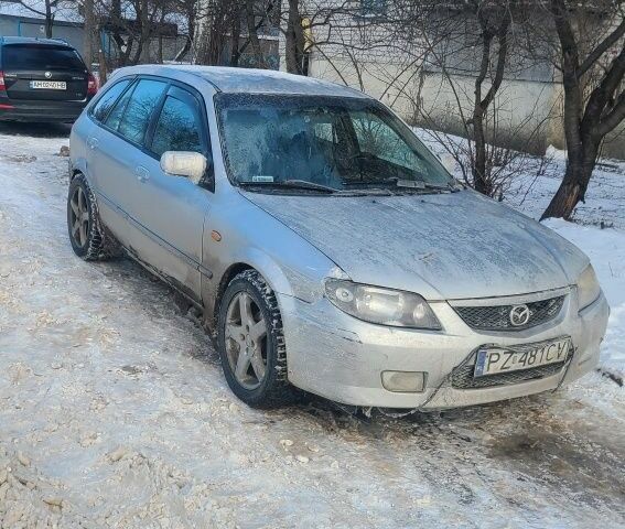 Серый Мазда 323, объемом двигателя 2 л и пробегом 300 тыс. км за 950 $, фото 1 на Automoto.ua