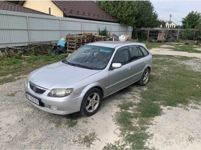 Сірий Мазда 323, об'ємом двигуна 2 л та пробігом 300 тис. км за 1600 $, фото 1 на Automoto.ua