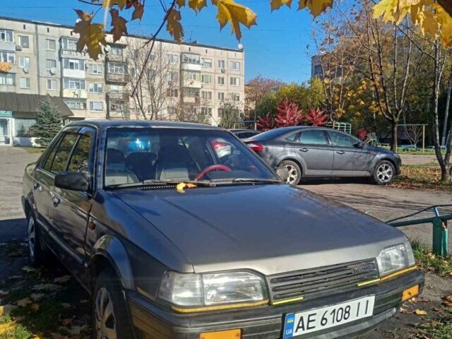 Серый Мазда 323, объемом двигателя 1.3 л и пробегом 300 тыс. км за 1100 $, фото 1 на Automoto.ua