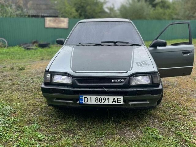 Серый Мазда 323, объемом двигателя 1.7 л и пробегом 80 тыс. км за 350 $, фото 1 на Automoto.ua