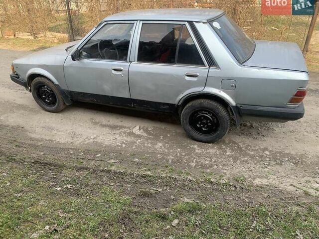 Серый Мазда 323, объемом двигателя 1.3 л и пробегом 400 тыс. км за 194 $, фото 1 на Automoto.ua