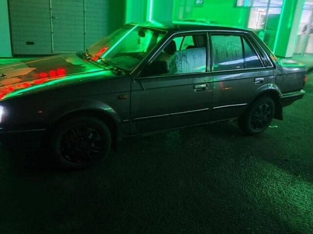 Серый Мазда 323, объемом двигателя 1.3 л и пробегом 200 тыс. км за 821 $, фото 1 на Automoto.ua