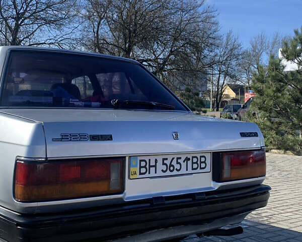 Сірий Мазда 323, об'ємом двигуна 1.3 л та пробігом 300 тис. км за 980 $, фото 1 на Automoto.ua