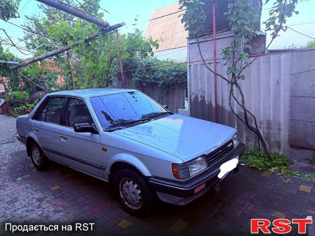 Серый Мазда 323, объемом двигателя 1.3 л и пробегом 92 тыс. км за 1300 $, фото 1 на Automoto.ua