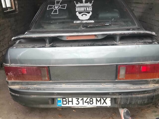 Серый Мазда 323, объемом двигателя 2 л и пробегом 200 тыс. км за 306 $, фото 1 на Automoto.ua