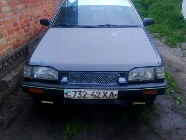 Серый Мазда 323, объемом двигателя 1.5 л и пробегом 320 тыс. км за 399 $, фото 1 на Automoto.ua