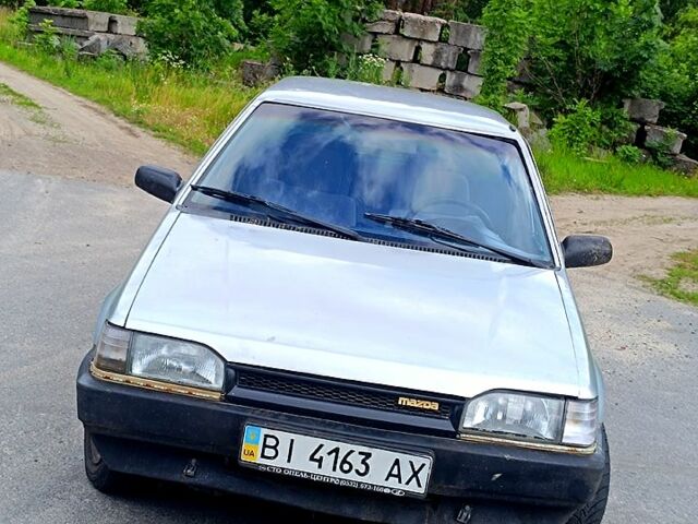 Серый Мазда 323, объемом двигателя 1.5 л и пробегом 300 тыс. км за 800 $, фото 1 на Automoto.ua