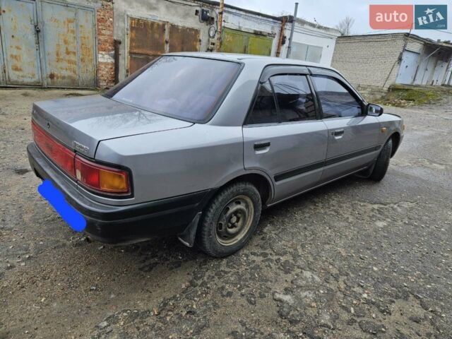 Серый Мазда 323, объемом двигателя 1.3 л и пробегом 130 тыс. км за 2500 $, фото 1 на Automoto.ua
