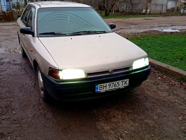 Серый Мазда 323, объемом двигателя 1.3 л и пробегом 389 тыс. км за 1650 $, фото 1 на Automoto.ua