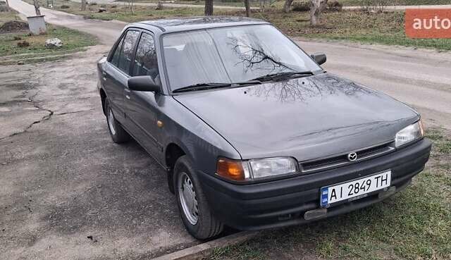 Сірий Мазда 323, об'ємом двигуна 1 л та пробігом 420 тис. км за 2700 $, фото 1 на Automoto.ua