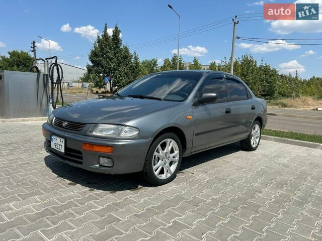 Сірий Мазда 323, об'ємом двигуна 1.49 л та пробігом 232 тис. км за 2600 $, фото 1 на Automoto.ua