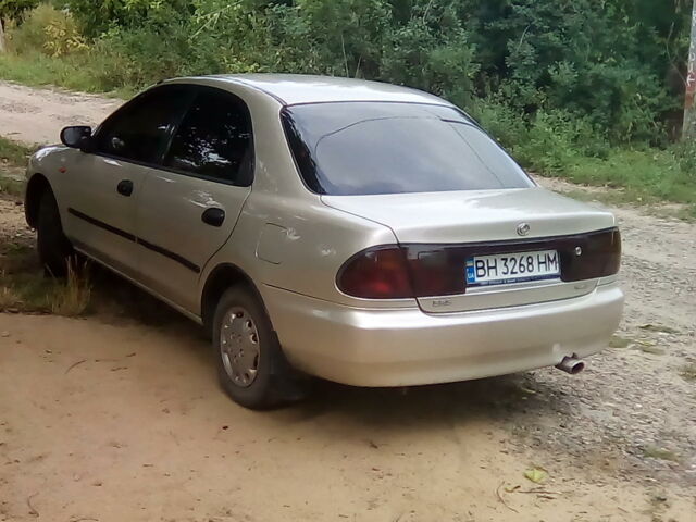Сірий Мазда 323, об'ємом двигуна 1.5 л та пробігом 250 тис. км за 3300 $, фото 1 на Automoto.ua