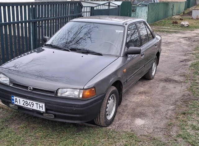 Сірий Мазда 323, об'ємом двигуна 1 л та пробігом 420 тис. км за 2700 $, фото 1 на Automoto.ua