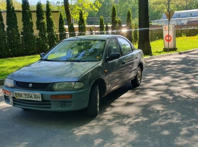 Сірий Мазда 323, об'ємом двигуна 1.5 л та пробігом 318 тис. км за 1250 $, фото 1 на Automoto.ua