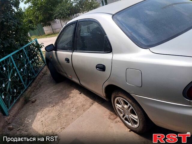 Сірий Мазда 323, об'ємом двигуна 1.5 л та пробігом 230 тис. км за 1100 $, фото 1 на Automoto.ua