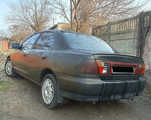 Серый Мазда 323, объемом двигателя 1.5 л и пробегом 500 тыс. км за 2000 $, фото 1 на Automoto.ua
