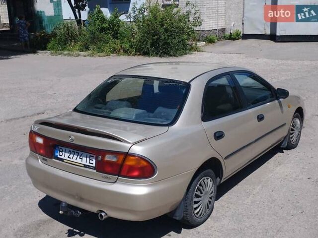 Серый Мазда 323, объемом двигателя 1.5 л и пробегом 390 тыс. км за 2600 $, фото 1 на Automoto.ua