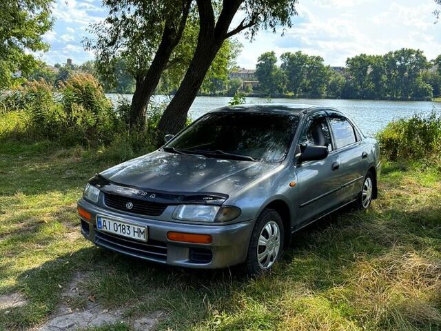 Серый Мазда 323, объемом двигателя 1.5 л и пробегом 220 тыс. км за 1490 $, фото 1 на Automoto.ua