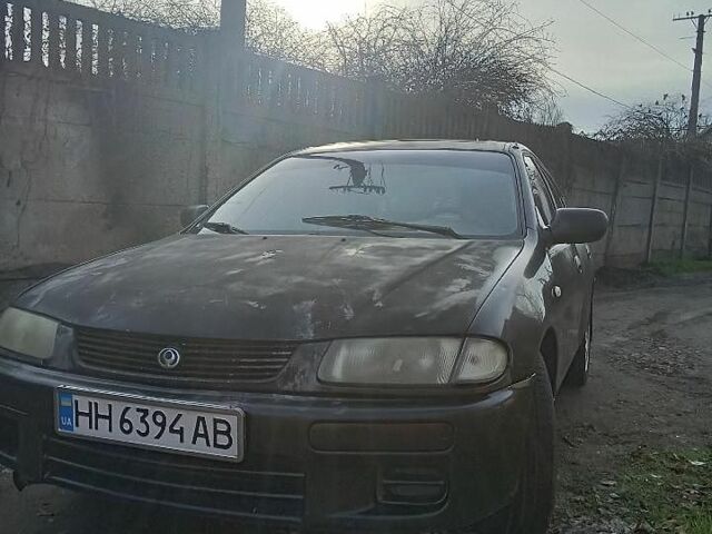 Сірий Мазда 323, об'ємом двигуна 1.5 л та пробігом 700 тис. км за 700 $, фото 1 на Automoto.ua