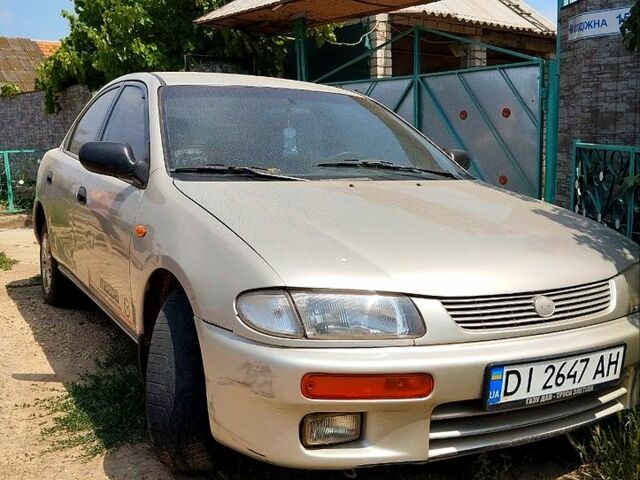 Сірий Мазда 323, об'ємом двигуна 1.5 л та пробігом 52 тис. км за 1000 $, фото 1 на Automoto.ua