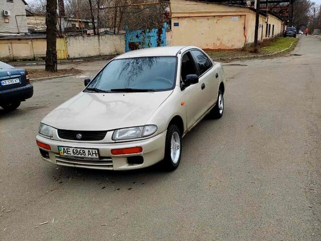 Серый Мазда 323, объемом двигателя 15 л и пробегом 270 тыс. км за 1000 $, фото 1 на Automoto.ua