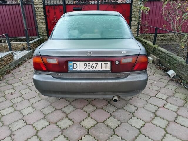 Серый Мазда 323, объемом двигателя 1.5 л и пробегом 200 тыс. км за 800 $, фото 1 на Automoto.ua