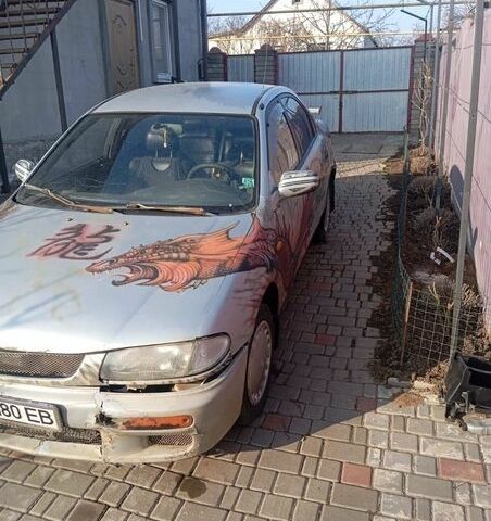 Сірий Мазда 323, об'ємом двигуна 1.5 л та пробігом 419 тис. км за 1100 $, фото 1 на Automoto.ua