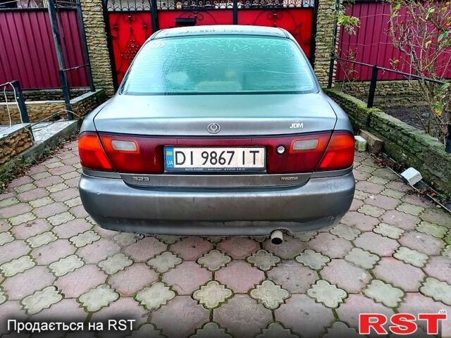 Сірий Мазда 323, об'ємом двигуна 1.5 л та пробігом 200 тис. км за 800 $, фото 1 на Automoto.ua