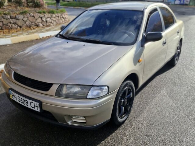 Серый Мазда 323, объемом двигателя 2 л и пробегом 234 тыс. км за 1350 $, фото 1 на Automoto.ua