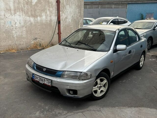 Сірий Мазда 323, об'ємом двигуна 1.49 л та пробігом 220 тис. км за 1400 $, фото 1 на Automoto.ua