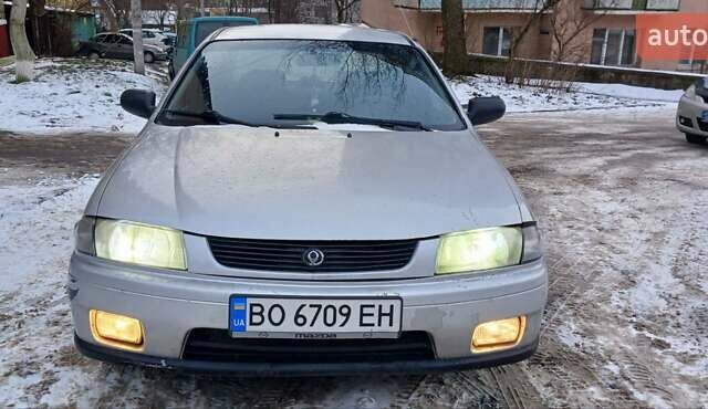 Серый Мазда 323, объемом двигателя 1.49 л и пробегом 250 тыс. км за 1900 $, фото 1 на Automoto.ua