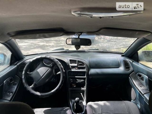 Сірий Мазда 323, об'ємом двигуна 1.5 л та пробігом 347 тис. км за 2000 $, фото 1 на Automoto.ua