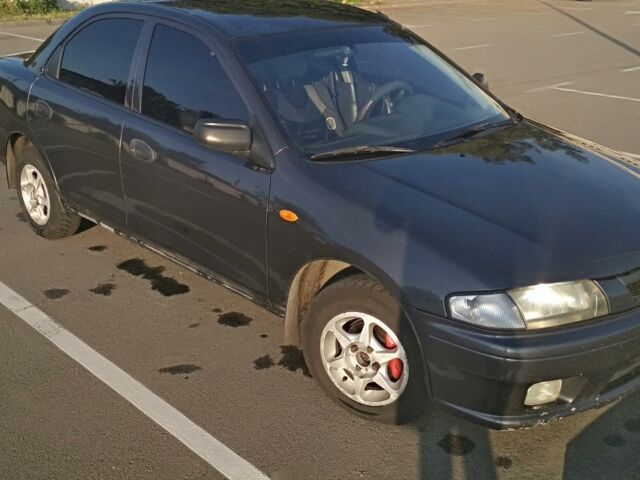 Сірий Мазда 323, об'ємом двигуна 1.5 л та пробігом 450 тис. км за 3200 $, фото 1 на Automoto.ua