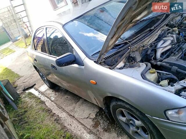 Сірий Мазда 323, об'ємом двигуна 1.5 л та пробігом 380 тис. км за 1700 $, фото 1 на Automoto.ua