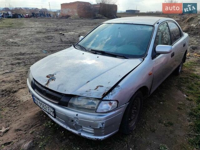 Серый Мазда 323, объемом двигателя 1.5 л и пробегом 250 тыс. км за 1000 $, фото 1 на Automoto.ua