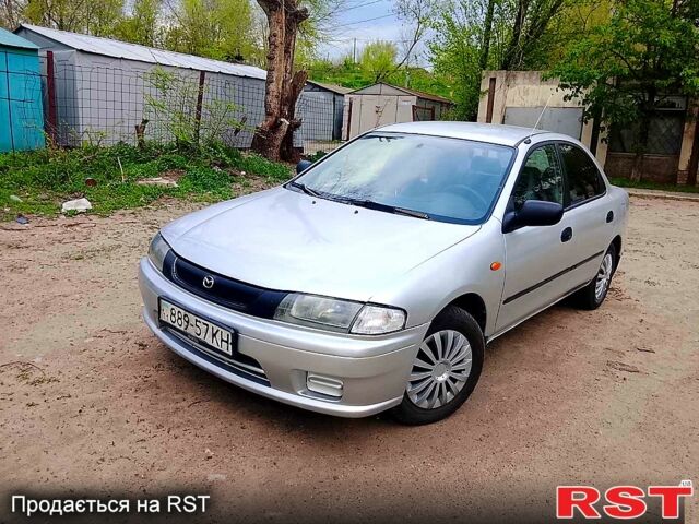 Серый Мазда 323, объемом двигателя 1.5 л и пробегом 245 тыс. км за 1500 $, фото 1 на Automoto.ua
