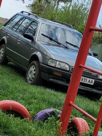 Серый Мазда 323, объемом двигателя 1.5 л и пробегом 378 тыс. км за 2000 $, фото 1 на Automoto.ua