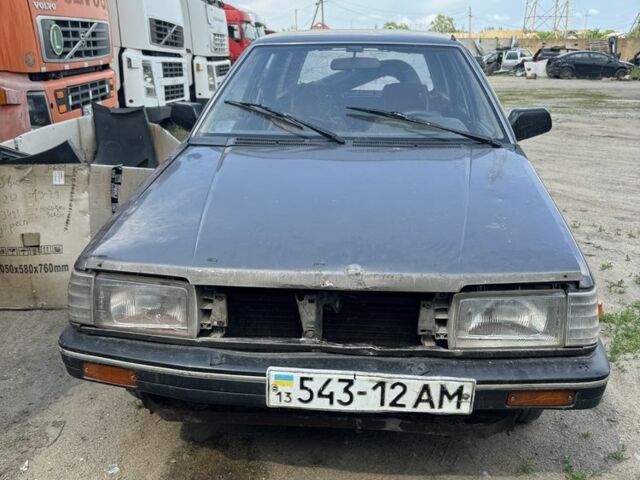 Серый Мазда 323, объемом двигателя 1.7 л и пробегом 300 тыс. км за 454 $, фото 1 на Automoto.ua