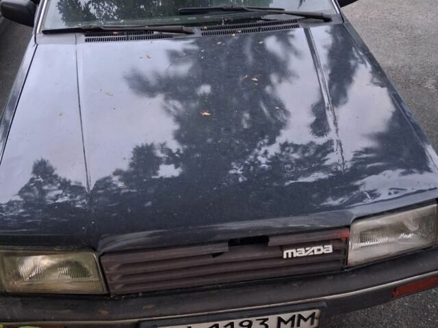 Синий Мазда 323, объемом двигателя 1.3 л и пробегом 200 тыс. км за 800 $, фото 1 на Automoto.ua