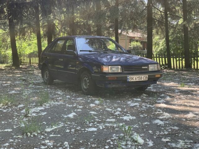 Синий Мазда 323, объемом двигателя 1.6 л и пробегом 350 тыс. км за 430 $, фото 1 на Automoto.ua